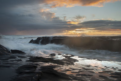 Scenic view of sea against sky during sunset