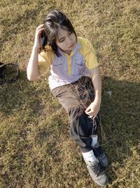 High angle view of teenage girl on field