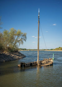 Scenic view of a wreck in the river against sky