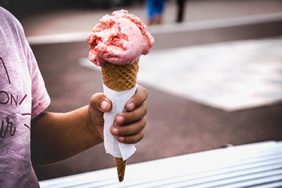 Baby girl holding ice cream cone