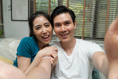 Portrait of a smiling young couple