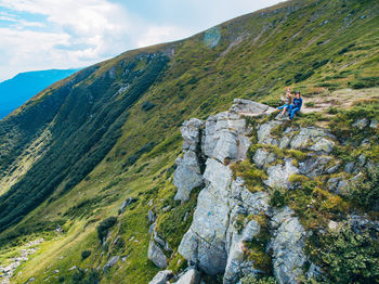 Rear view of man walking on mountain