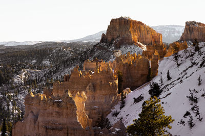 Desaturated monochrome fine art photo style of bryce canyon national park during the day in winter 