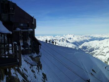 Scenic view of snow covered mountains against sky