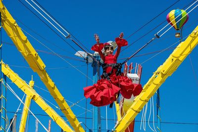 Low angle view of cables against clear blue sky