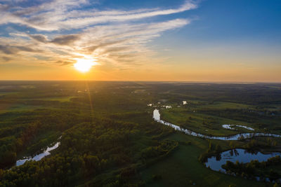 Beautiful orange sunset over the teza river in the ivanovo region, photo taken from a drone.