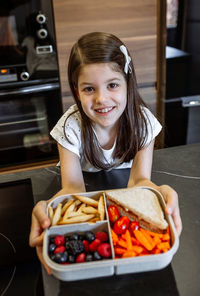 Portrait of smiling girl at home