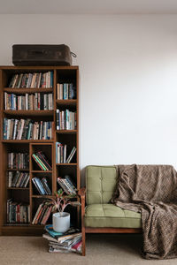 Bookshelf and sofa against wall