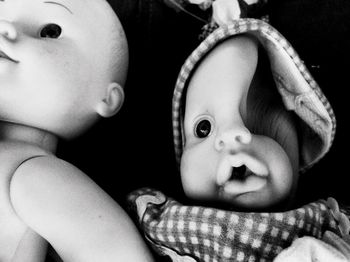 Close-up portrait of cute baby lying down on bed