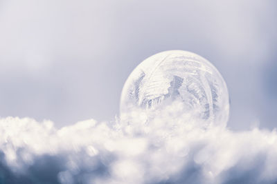 Close-up of ice against sky