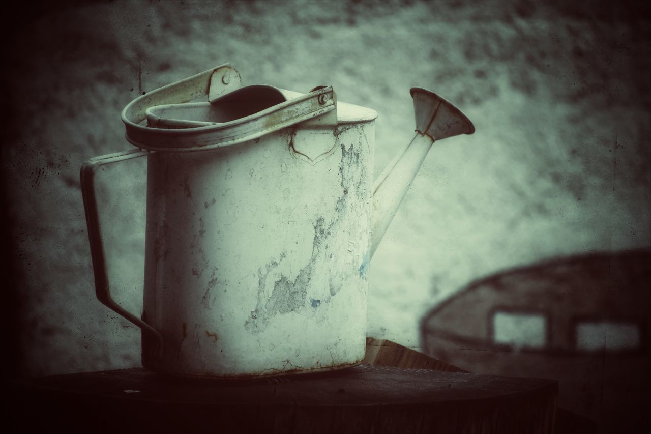 CLOSE-UP OF OLD MACHINE ON TABLE