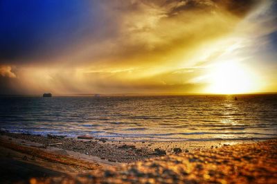 Scenic view of sea at sunset