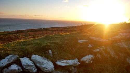 Scenic view of sea against sky during sunset