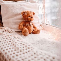 Close-up of stuffed toy on bed