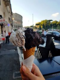 Hand holding ice cream cone