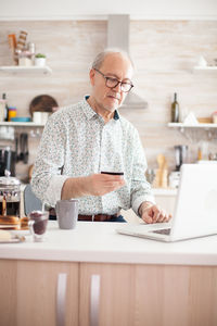 Man using laptop on table