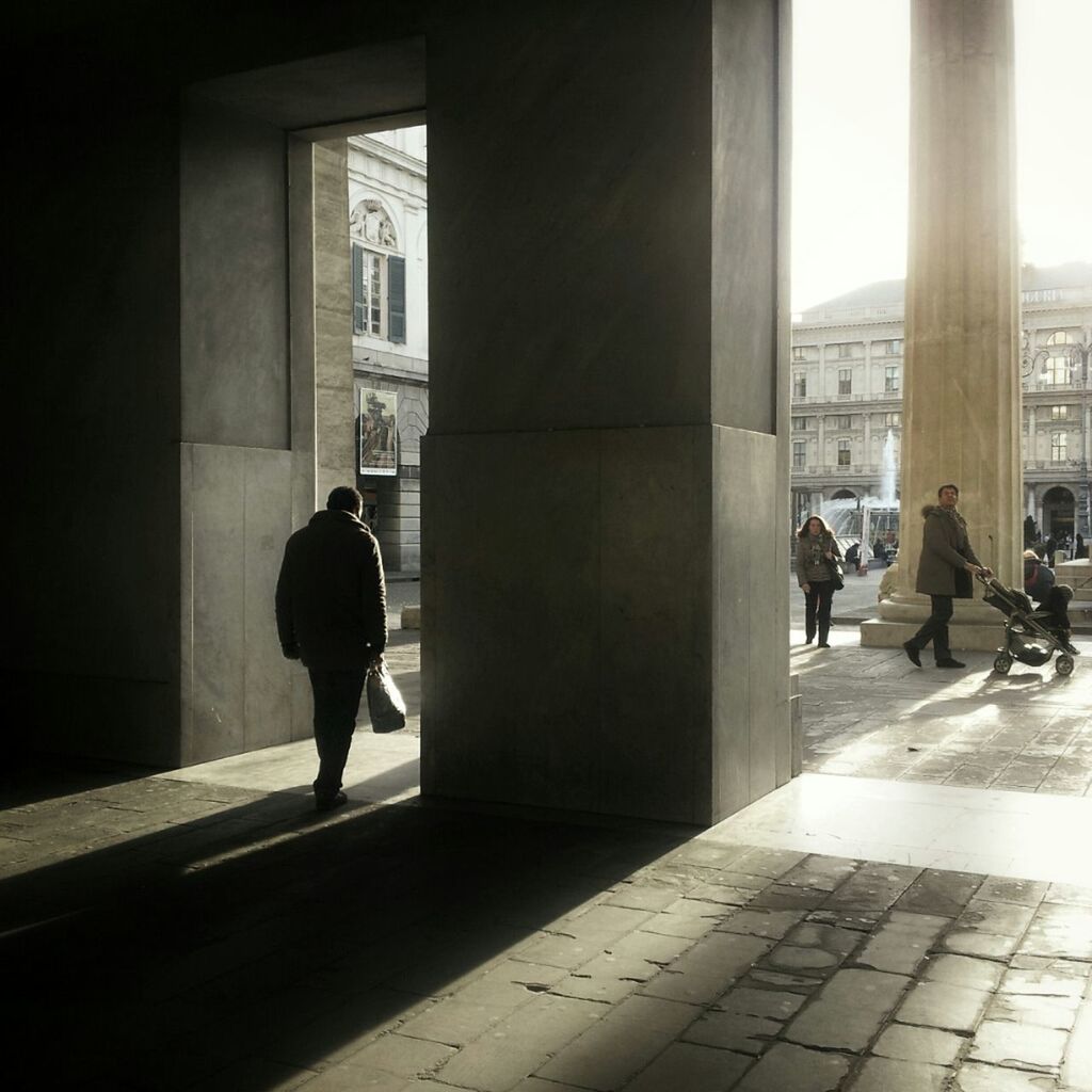 architecture, built structure, men, indoors, building exterior, full length, walking, lifestyles, window, person, city, silhouette, glass - material, city life, rear view, building, leisure activity