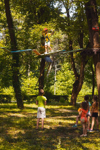 People in park against trees