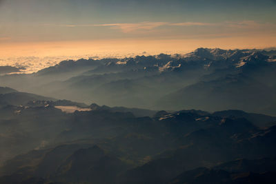 Scenic view of mountains against sky during sunset