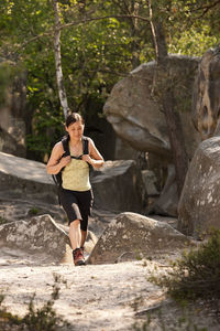 Mature woman exploroing the forest of fontainebleau close to paris