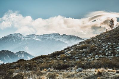 Scenic view of snowcapped mountains against sky