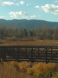 Scenic view of landscape and mountains against sky