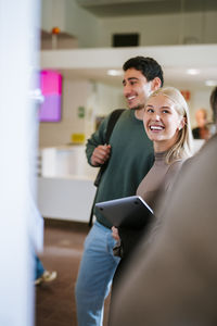 Portrait of young woman using mobile phone