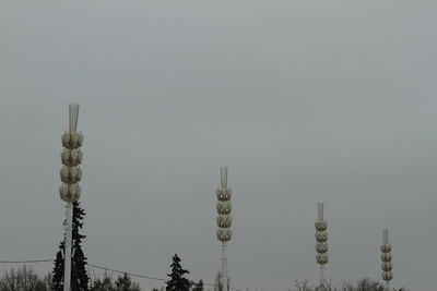 Low angle view of communications tower against sky