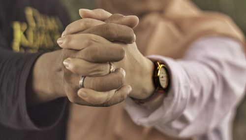 Close-up of man holding hand