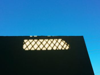 Low angle view of building against blue sky