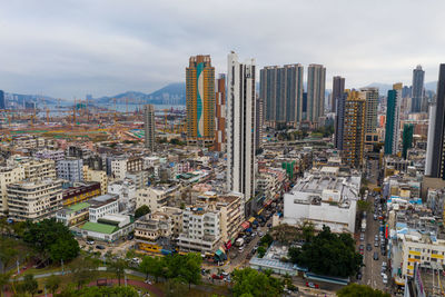 High angle view of buildings in city against sky