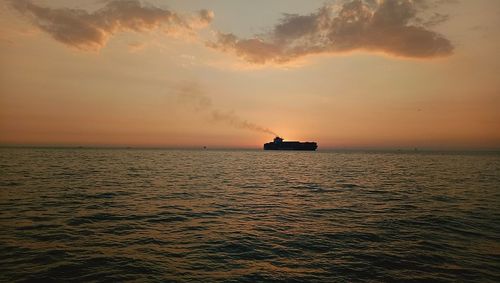 Scenic view of sea against sky during sunset