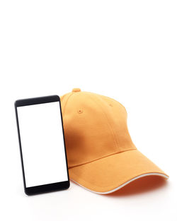 Close-up of mobile phone against white background