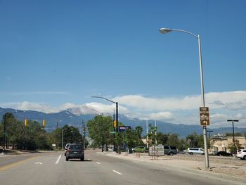 Cars on road against sky