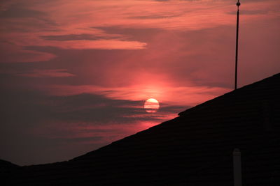 Silhouette landscape against scenic sunset