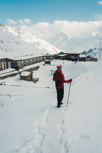 Man skiing on snow covered mountain