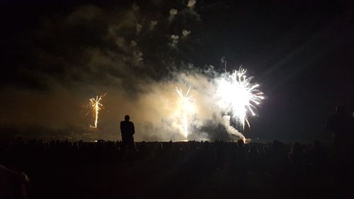 Firework display at night