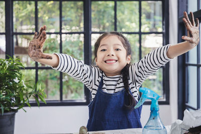 Portrait of smiling boy in the window