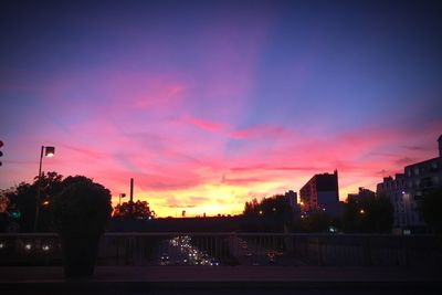 View of illuminated city at sunset