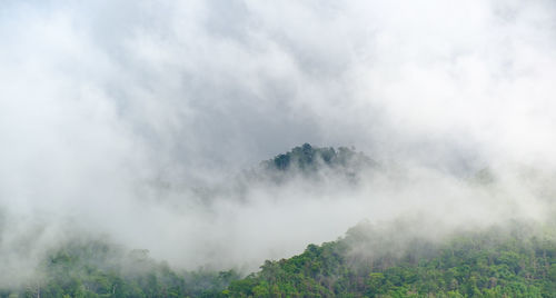 Scenic view of waterfall against sky