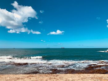 Scenic view of sea against blue sky