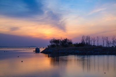 Scenic view of sea against sky during sunset