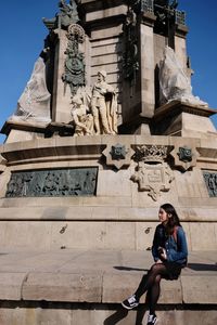 Low angle view of statue against building