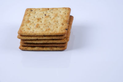 Stack of bread against white background