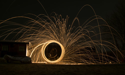 Light painting against sky at night