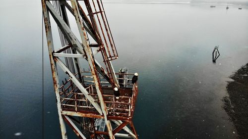 High angle view of ferris wheel in lake