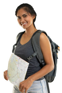 Portrait of a smiling young woman against white background