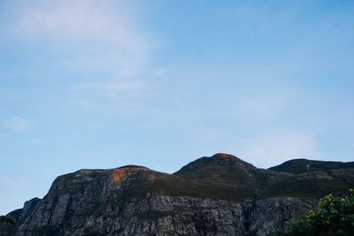 Low angle view of rock formations against sky