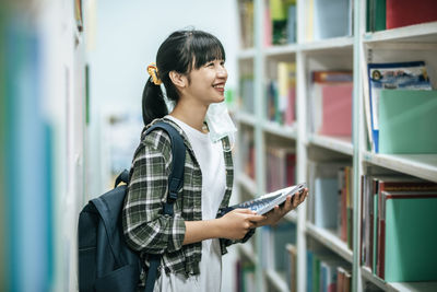 Young woman reading book