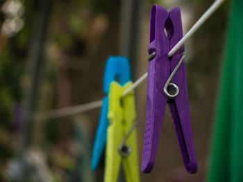 Close-up of multi colored objects against blue sky